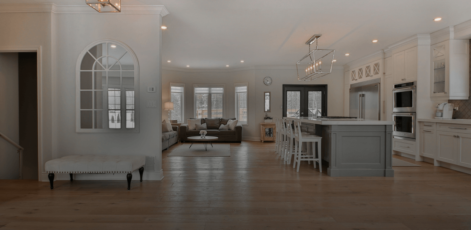 a living room with a kitchen and dining area